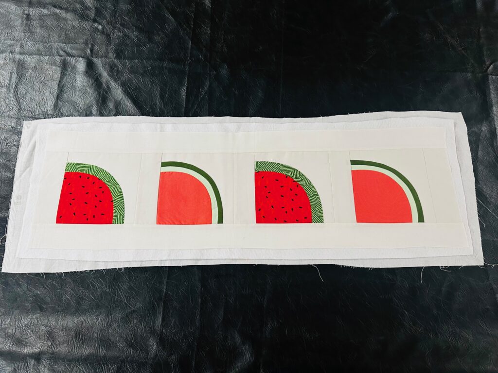 watermelon runner with backing and batting layered