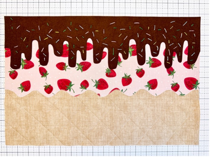 Felty fudge drippings fused to placemat upper edge