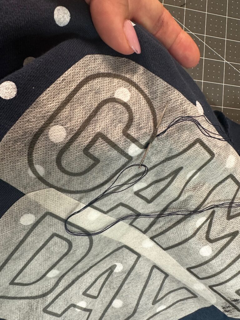 stitching letters on sweatshirt