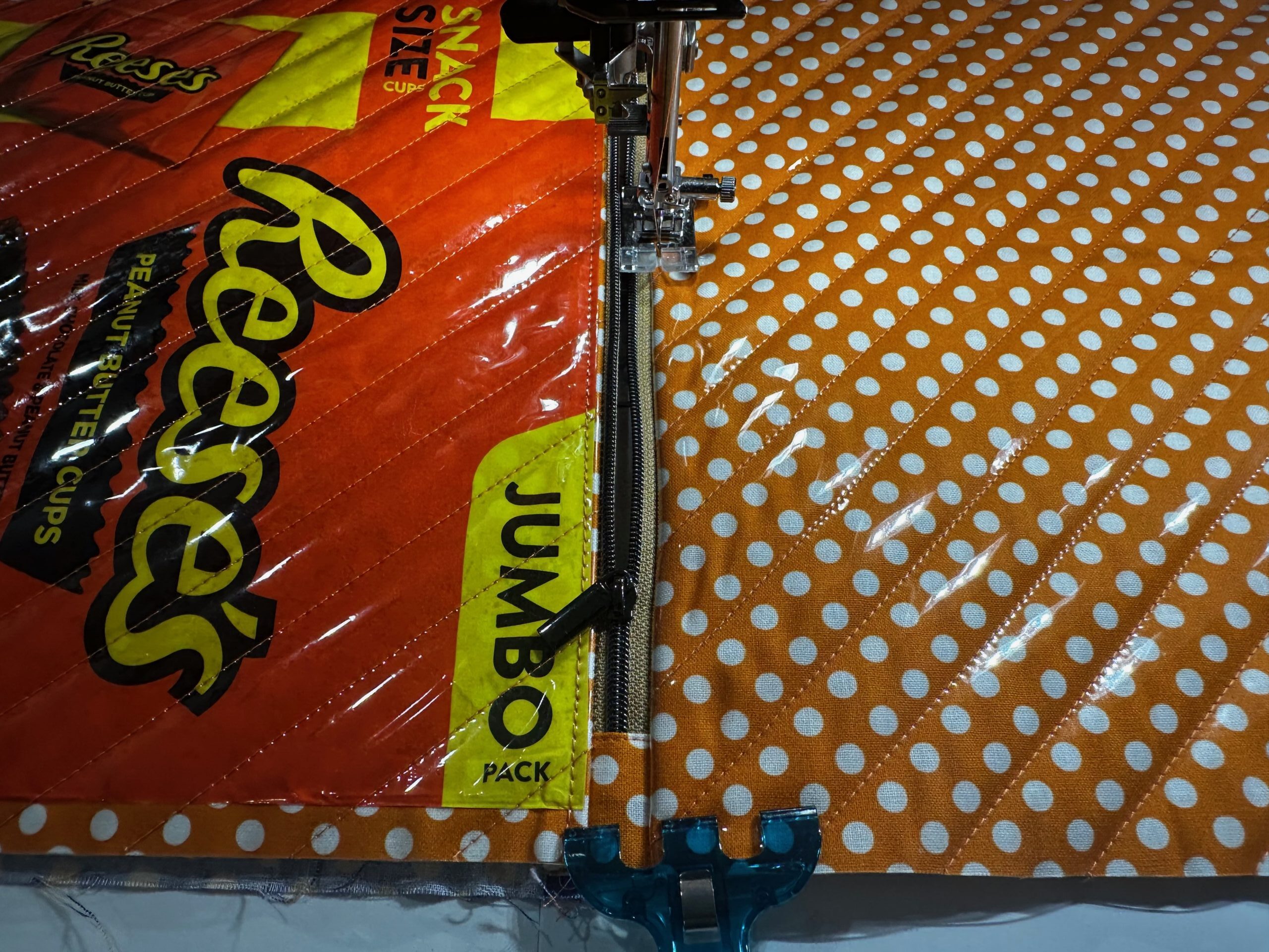 applying zipper to exterior back of candy pouch